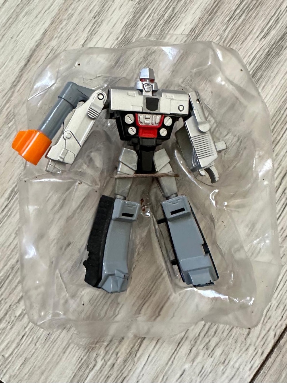 Silver and Gray Robot Action Figure with Orange Accent